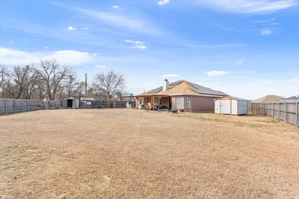 Spacious Living, a Backyard Built for Enjoyment, and Paid-Off Solar Panels,